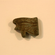 Udjat-eye amulet from grey-brown faience